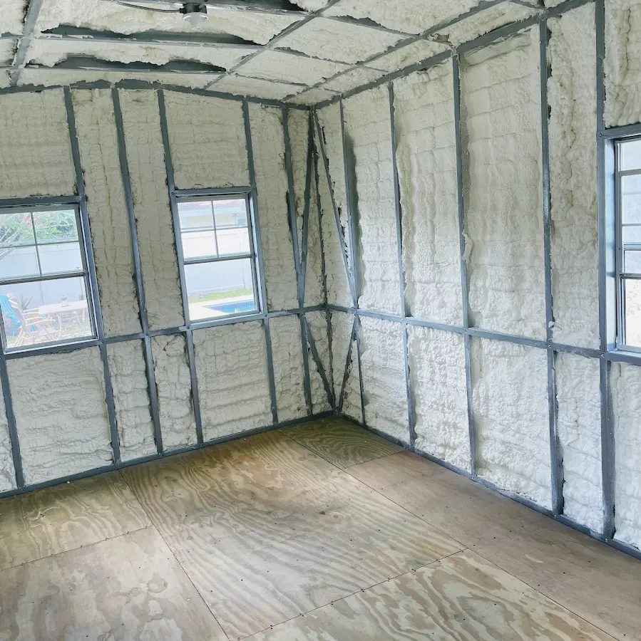 Closed-cell spray foam insulation applied to wall cavities in a residential project in Northwood